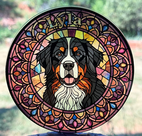 Round Bernese Mountain Dog stained-glass acrylic medallion hanging in a window